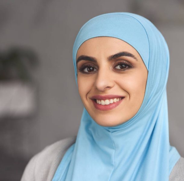 stock-photo-portrait-smiling-beautiful-muslim-woman-hijab-home